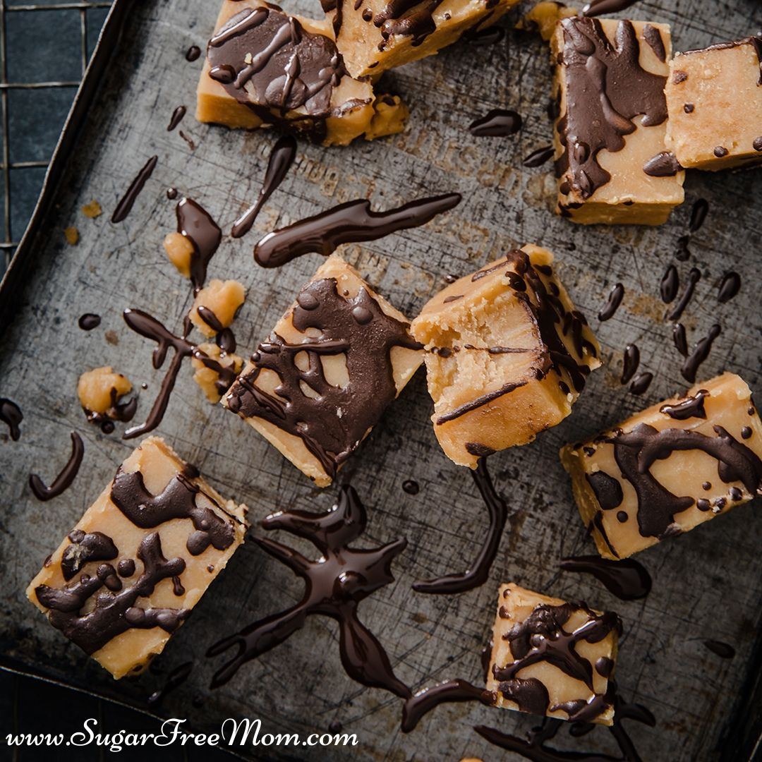 square desserts on a baking sheet drizzled in chocolate