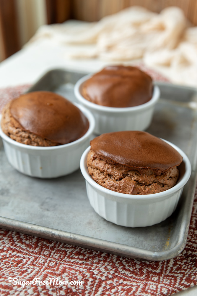 3 mini keto chocolate souffles on sheet pan 
