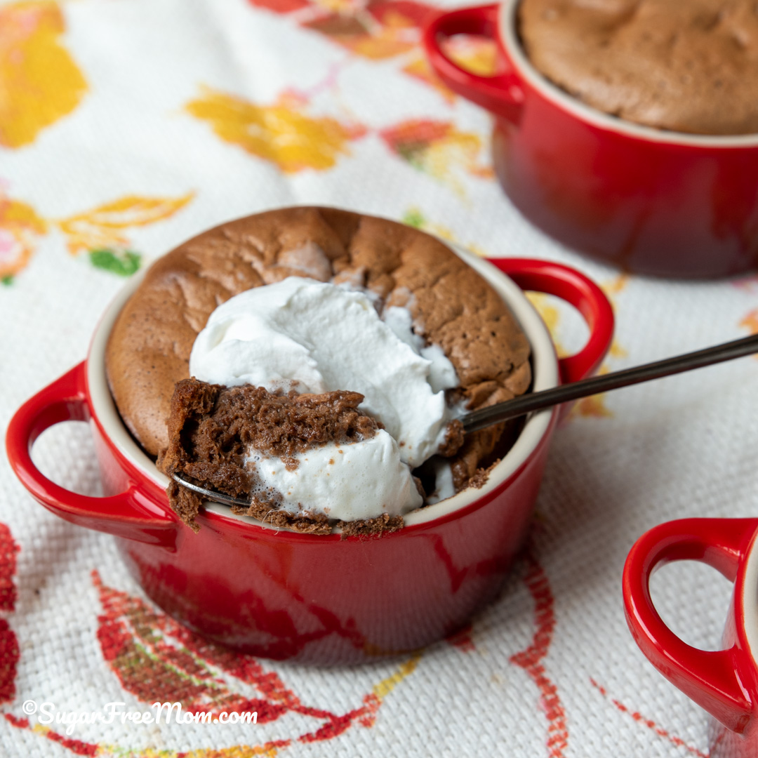 mini sugar free keto chocolate souffle with whipped cream on top