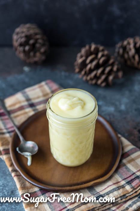 glass jar of condensed milk on a plate