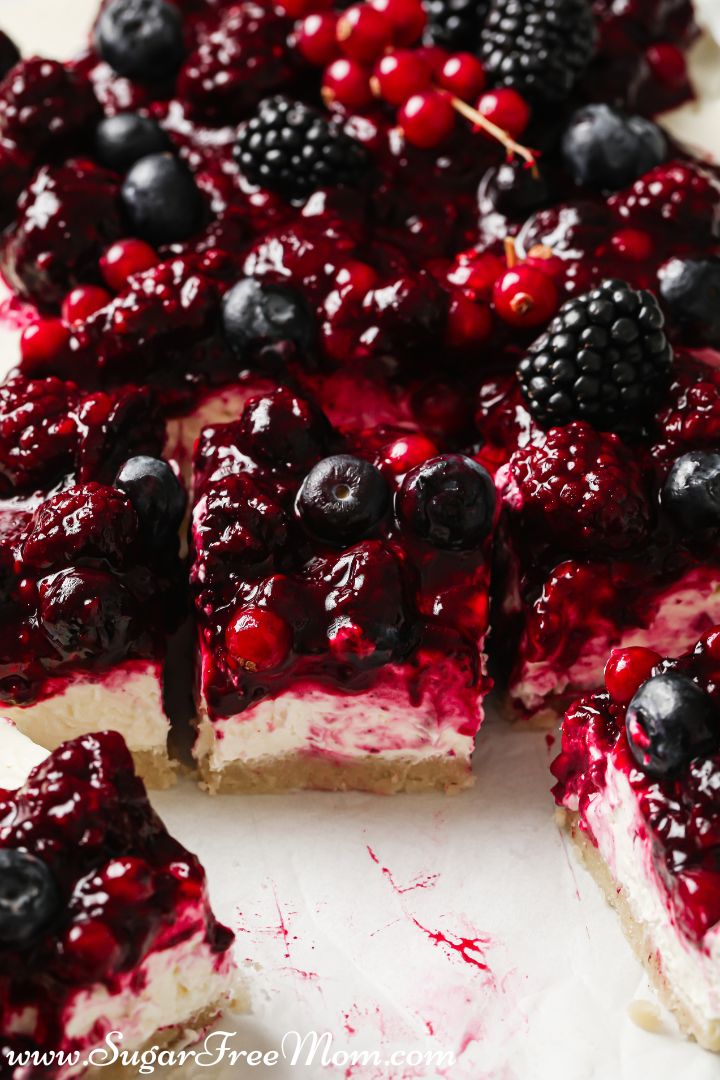 close up view of cheesecake with fresh berry mixture on top
