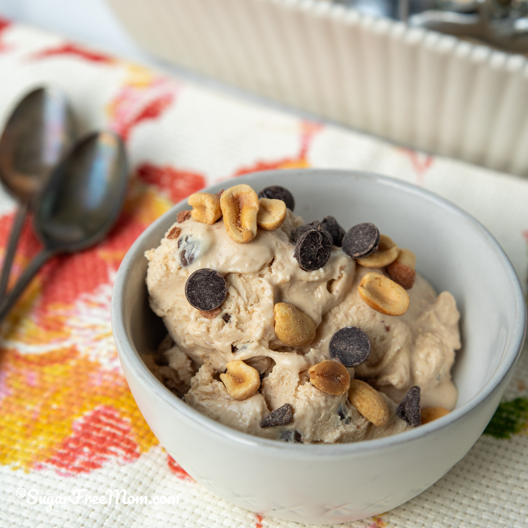 bowl of icecream topped with chocolate chips and nuts