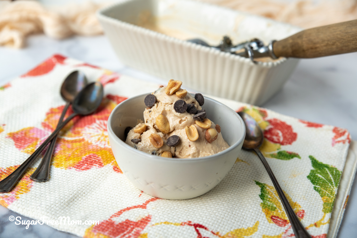 bowl of icecream next to spoons on the sides