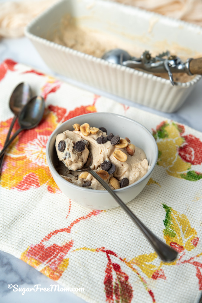 spoonful of icecream laying in a bowl of icecream