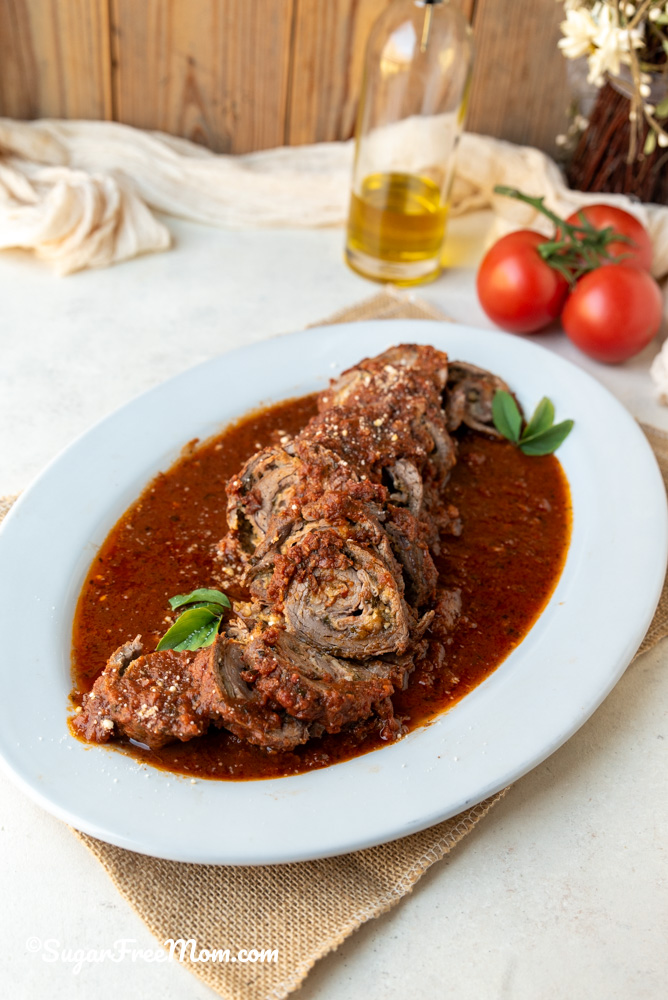 This keto Italian Braciole recipe is perfect Italian food for a special occasion holiday! It's essentially a stuffed flank steak with Sicilian flavors and easier to make than you think!