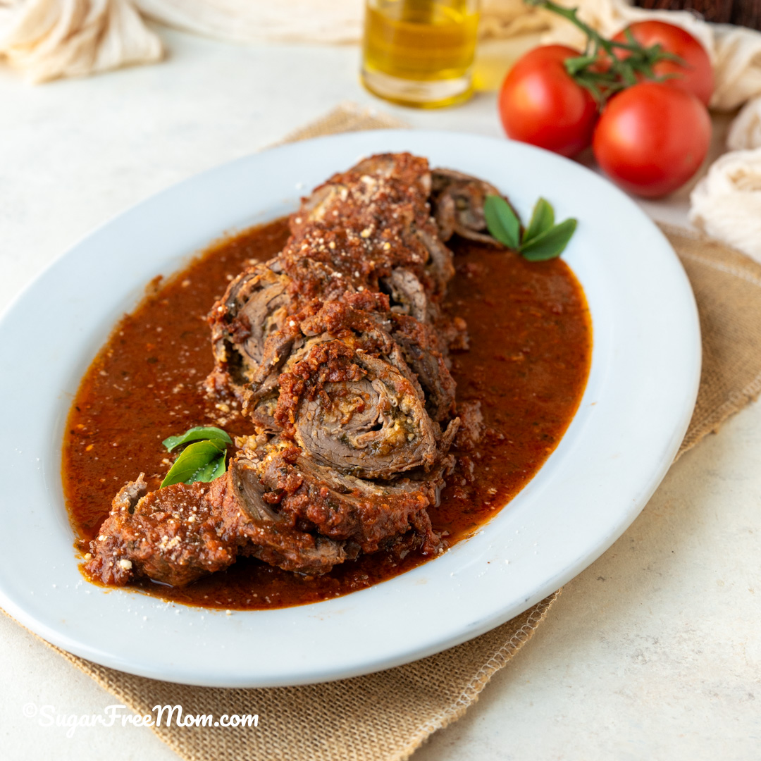 This keto Italian Braciole recipe is perfect Italian food for a special occasion holiday! It's essentially a stuffed flank steak with Sicilian flavors and easier to make than you think!