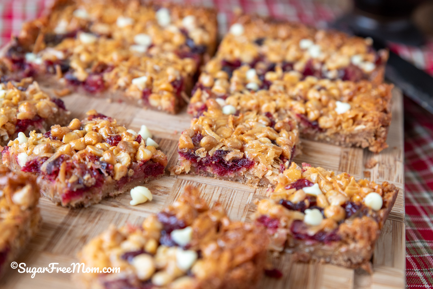 These Keto Cranberry White Chocolate Magic Bars are a festive, low carb, nut-free holiday bar with a golden brown crust, chewy cranberries, creamy layers, and the perfect holiday twist!
