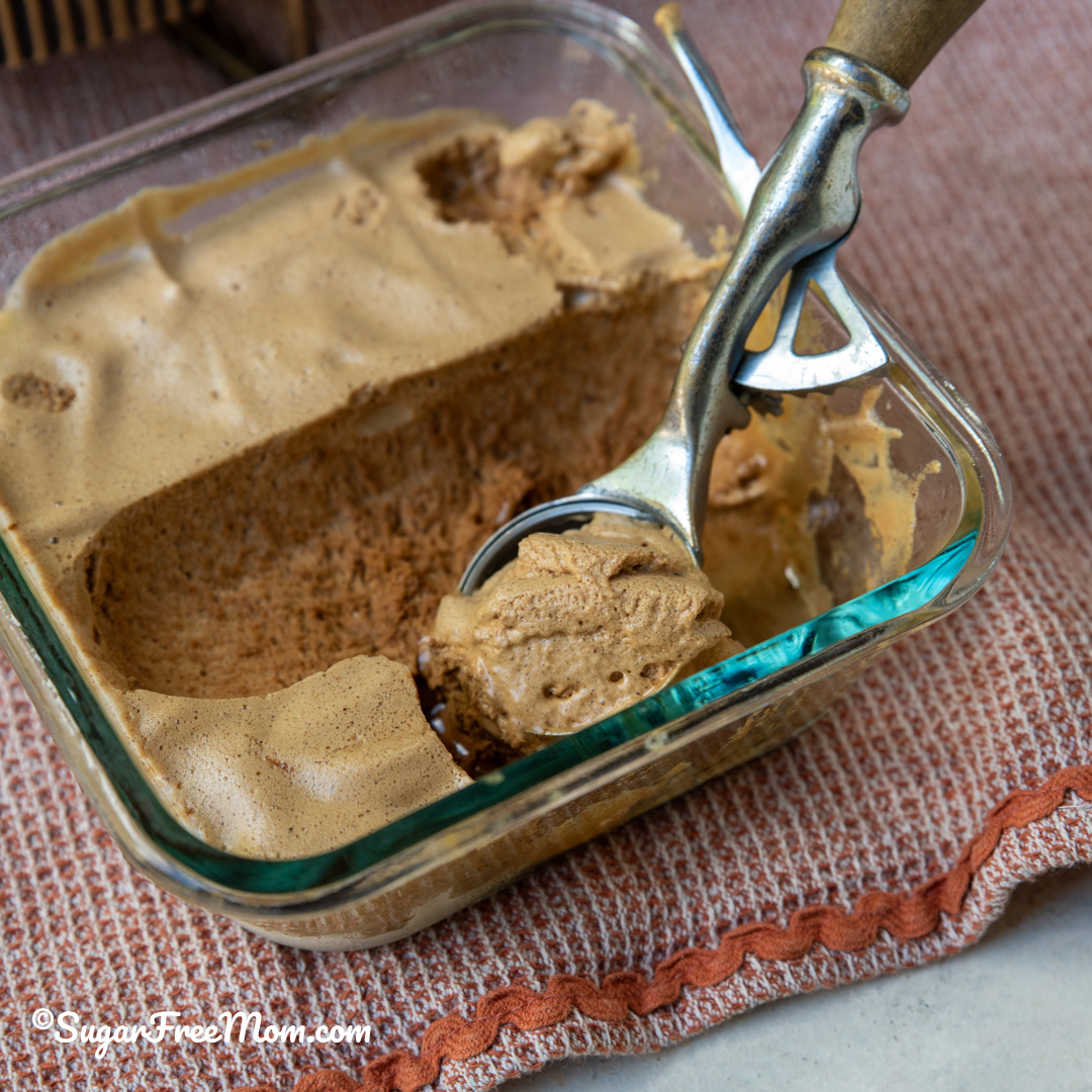 square image of keto frozen whipped Dalgona coffee in an ice cream scoop
