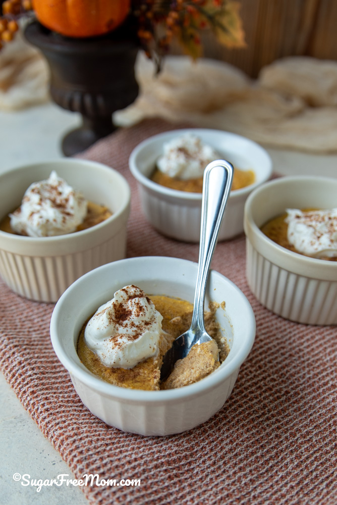 close up image of a spoonful in ramekin of sugar free pumpkin ricotta custard